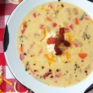 3-Cheese-Corn-Chowder is full of all the comforts of home with plenty of vegetables, crisp bacon, and three types of creamy cheeses in one flavorful soup.