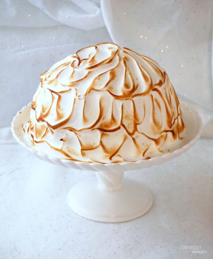 Baked-Alaska is made by encasing layers of tender cake and smooth ice cream in a silky meringue, and then toasting it in the oven. Baked Alaska is a fun and whimsical dessert that is as easy to make as it is impressive to serve.