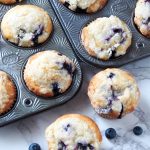bakery style blueberry muffins in a vintage muffin tin.