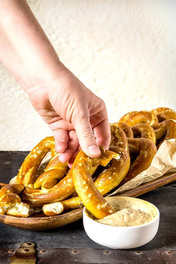  A gooey cup of beer cheese sauce with fresh hot pretzels for dipping. 