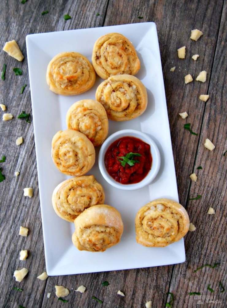 Cheesy-Italian-Herb-Pinwheels are buttery biscuits rolled with Italian seasoning and plenty of cheese for a savory three-bite appetizer that everyone will enjoy.