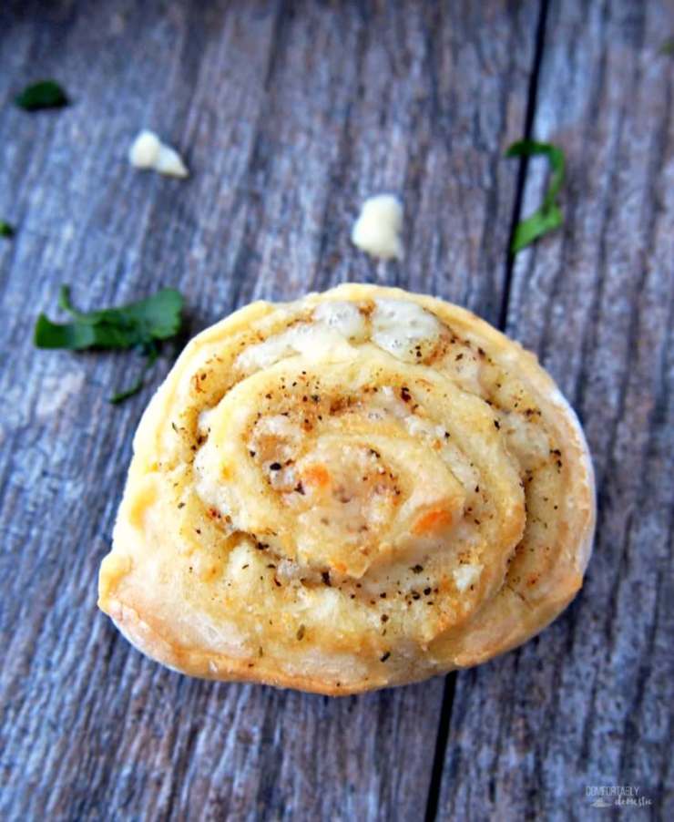 Cheesy-Italian-Herb-Pinwheels are buttery biscuits rolled with Italian seasoning and plenty of cheese for a savory three-bite appetizer that everyone will enjoy.