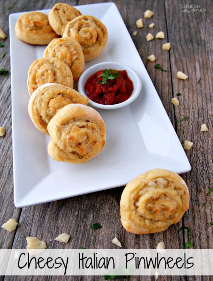 Cheesy-Italian-Herb-Pinwheels are buttery biscuits rolled with Italian seasoning and plenty of cheese for a savory three-bite appetizer that everyone will enjoy.