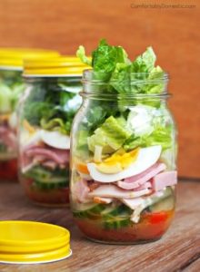 Chef Salad in a Jar - Crisp romaine lettuce, fresh vegetables, ham, turkey, egg, cheese, & a tasty parmesan vinaigrette dressing.