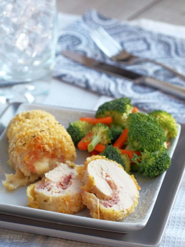 Chicken-Cordon-Bleu is a simple yet elegant weeknight dinner of tender breaded chicken rolled around ham and cheese.