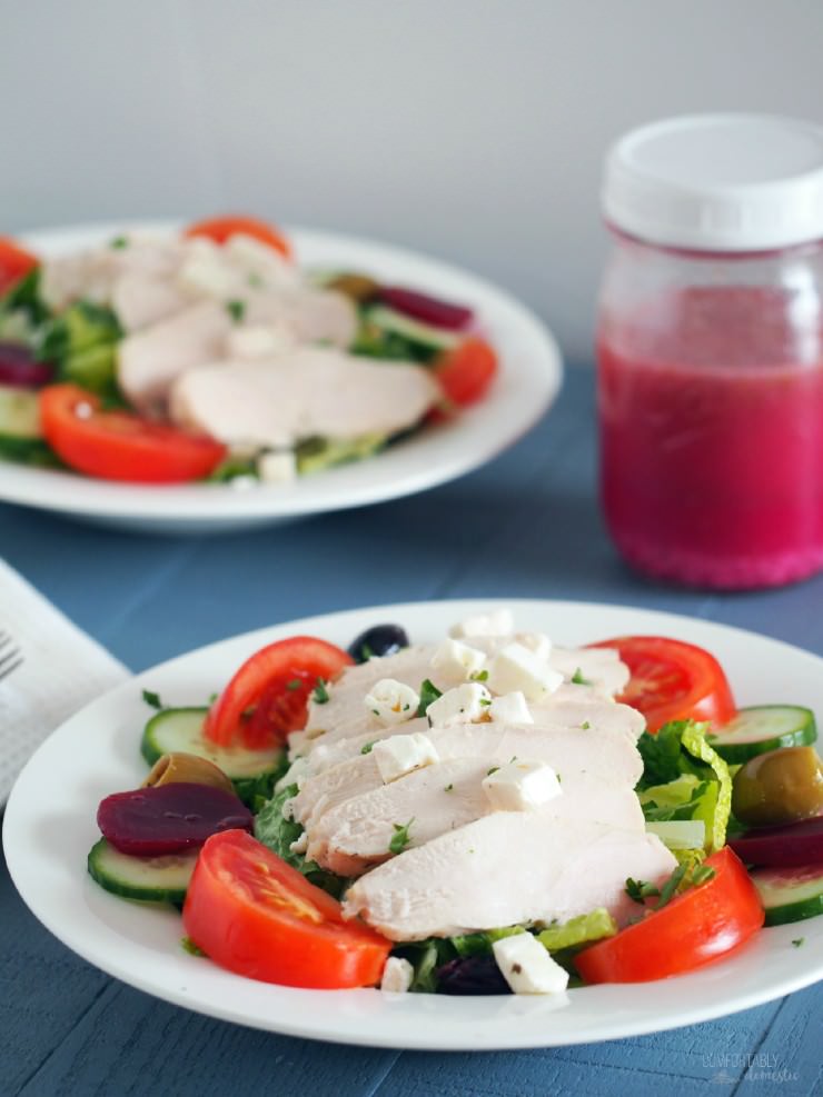 Chicken-Greek-Salad rests tender chicken atop such traditional ingredients as crisp greens, pickled beets, tomato, cucumber, olives, red onion, plenty of feta cheese, and a healthy drizzle of restaurant style Greek dressing.