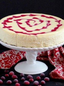 Cranberry Swirl Cheesecake - Thick, rich, and super creamy cheesecake adorned with a tangy swirl of fresh cranberries makes dessert a perfectly decadent experience. | ComfortablyDomestic.com