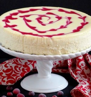 Cranberry Swirl Cheesecake - Thick, rich, and super creamy cheesecake adorned with a tangy swirl of fresh cranberries makes dessert a perfectly decadent experience. | ComfortablyDomestic.com