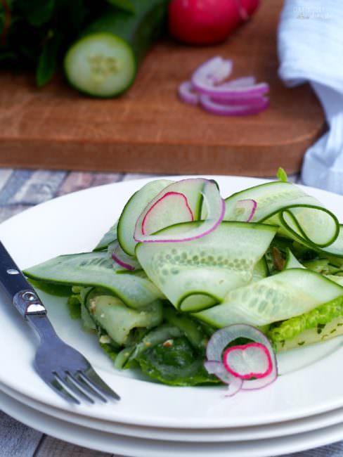 Cucumber-Ribbon-Salad tosses fun ribbons of ripe cucumber and other vegetables with a flavorful fresh pesto dressing in a cool and crunchy summer salad.