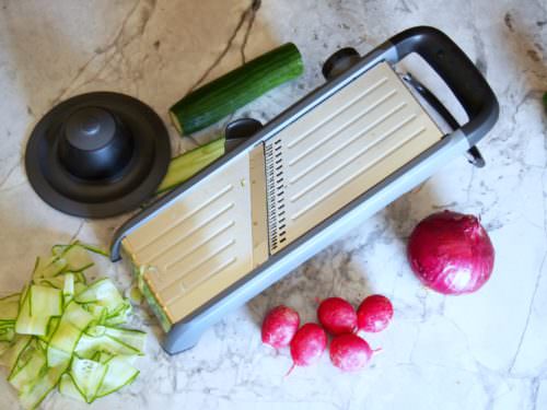 Cucumber-Ribbon-Salad tosses fun ribbons of ripe cucumber and other vegetables with a flavorful fresh pesto dressing in a cool and crunchy summer salad.