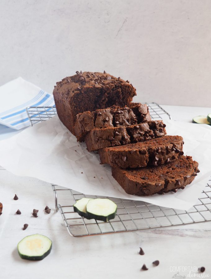 Thick slices of double chocolate zucchini bread on a white background.