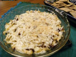 Hot dip recipes like this Sun-Dried tomato and artichoke dip are perfect party appetizers! Recipe on ComfortablyDomestic.com