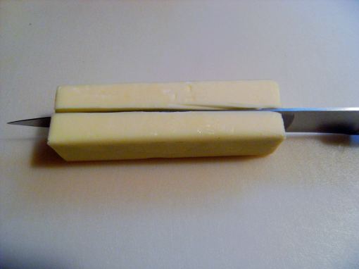 a stick of butter, cut in half