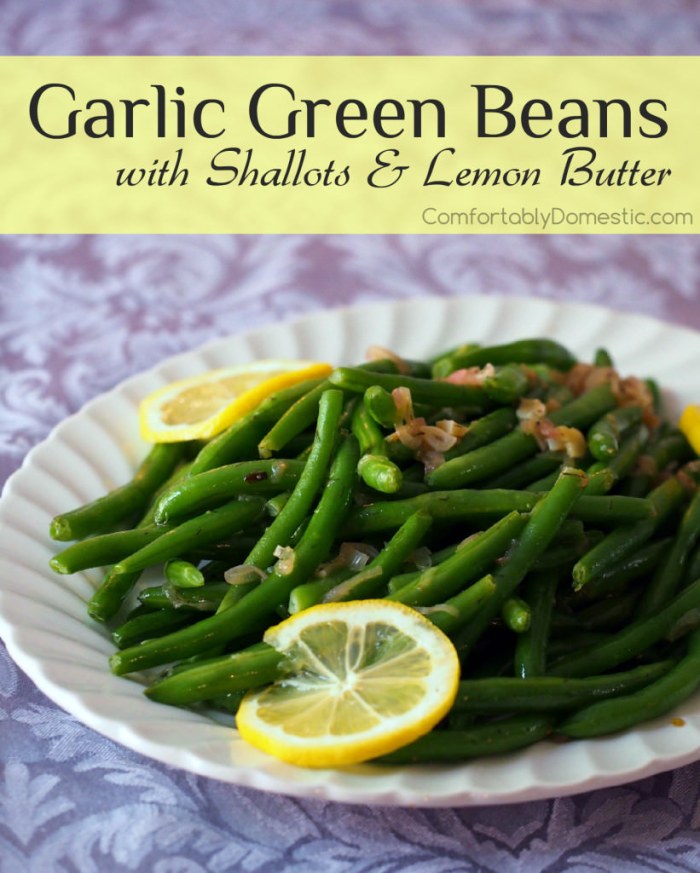 Garlic green beans are a delicious, easy to make holiday side dish! Fresh green beans are lightly steamed and tossed with a bright, lemon garlic butter sauce with caramelized shallots. | Get the recipe from ComfortablyDomestic.com