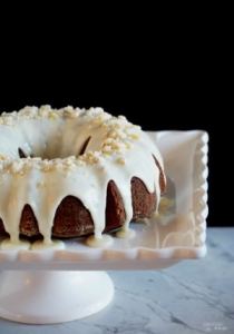 Gingerbread Cake with Orange Cream Glaze - Richly spiced Gingerbread Cake tickles the tongue with added depth of molasses, brightened with citrus notes of orange. | ComfortablyDomestic.com