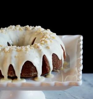 Gingerbread Cake with Orange Cream Glaze - Richly spiced Gingerbread Cake tickles the tongue with added depth of molasses, brightened with citrus notes of orange. | ComfortablyDomestic.com