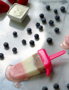 Red White and Blueberry Frozen Yogurt Pops - Sweet vanilla yogurt blended with fresh strawberries and blueberries, and then layered for a guilt-free, fun, and creamy frozen treat. | Comfortably Domestic