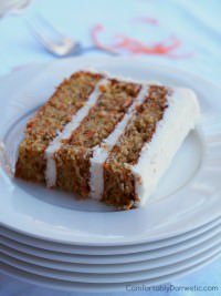 Delicately spiced carrot cake, loaded with finely shredded carrots and a tender crumb, enrobed in a fluffy crystallized ginger cream cheese frosting. | ComfortablyDomestic.com