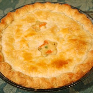 Chicken pot pie. Nothing says 'comfort food' better than tender chicken and vegetables in a rich gravy, covered with a flaky, buttery pastry crust. | Recipe on ComfortablyDomestic.com