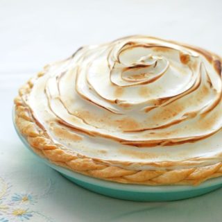 The-Best-Lemon-Meringue-Pie features exceptionally tangy lemon custard filling topped with toasted sweet meringue, cradled in a golden, buttery crust.
