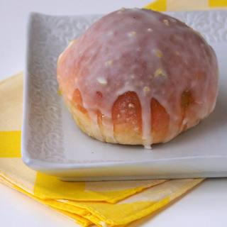 Baked Lemon Custard Doughnuts {Lemon Paczki} are a lighter version of traditional paczki. Get the recipe on comfortablydomestic.com