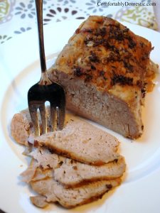 Pork roast made in a slow cooker is incredibly easy to make. The best part is that two separate meals can be created from this slow cooker garlic pork roast recipe! | ComfortablyDomestic.com