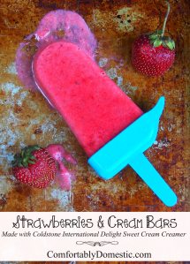 Strawberries and cream, in the form of frozen bars, makes for a tasty and refreshing summer time treat! Easy to make with the help of Cold Stone International Delights creamer! | ComfortablyDomestic.com