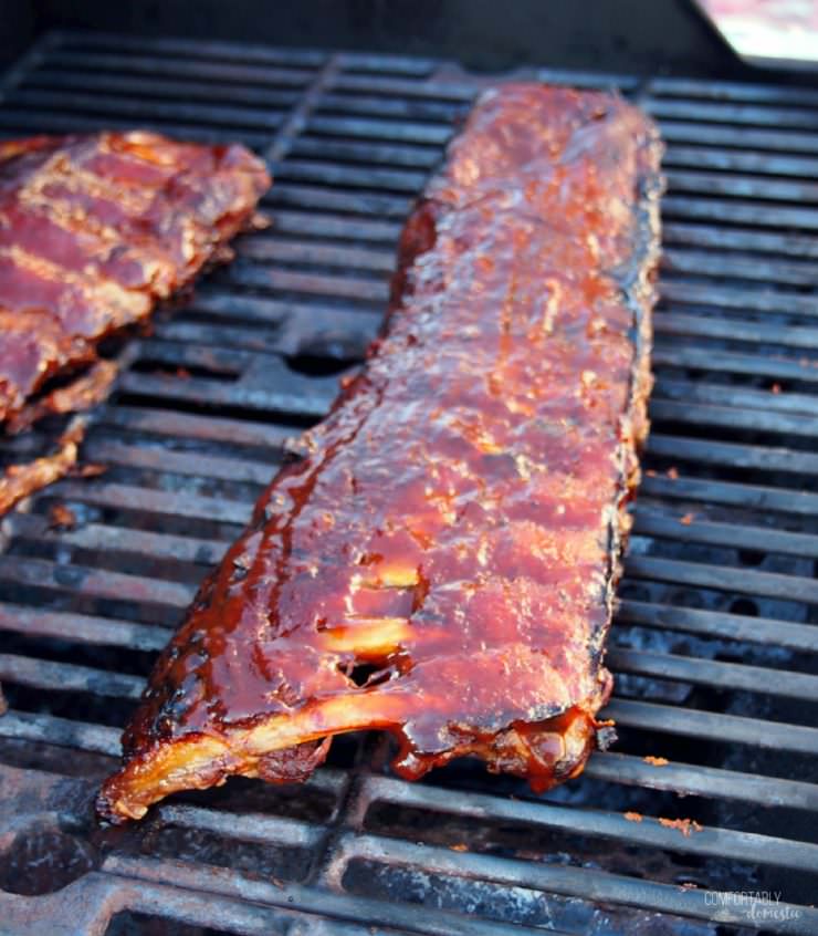 Perfect Barbecued Ribs are slow roasted and finished on the grill with a sticky-sweet sauce, for ribs that are fall-off-the-bone tender.