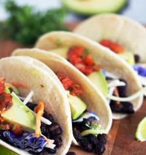 Spicy-Roasted-Black-Bean-Tacos is an easy vegetarian meal made with seasoned black beans, oven roasted to enhance the depth of the spices and compliment the satisfying fresh flavors. These tacos are anything but bland or ordinary!