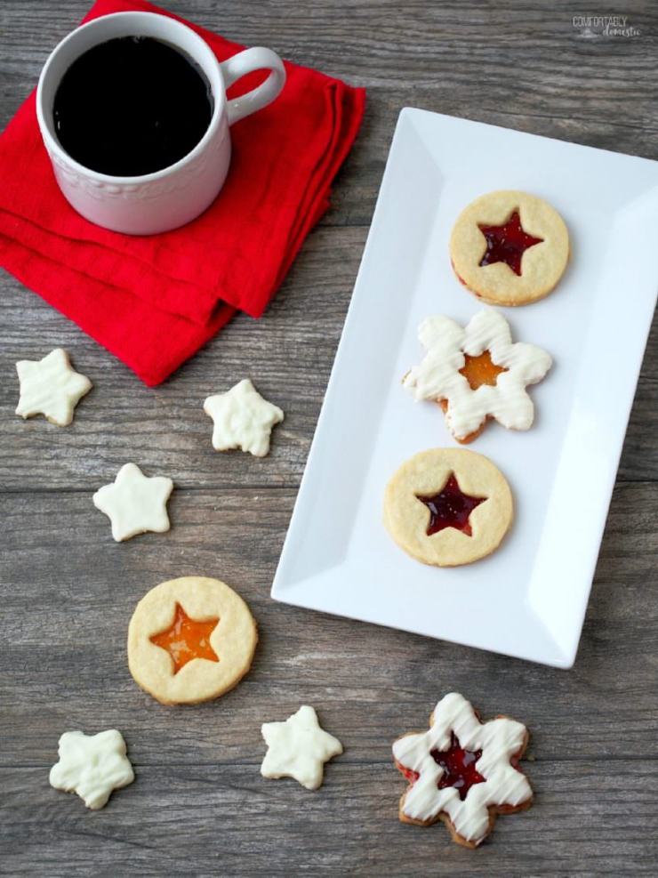 Shortbread-Linzer-Cookies are rich buttery shortbread cookies with a thin layer of preserves sandwiched between them to look like linzer cookies. They're as beautiful as they are delicious!