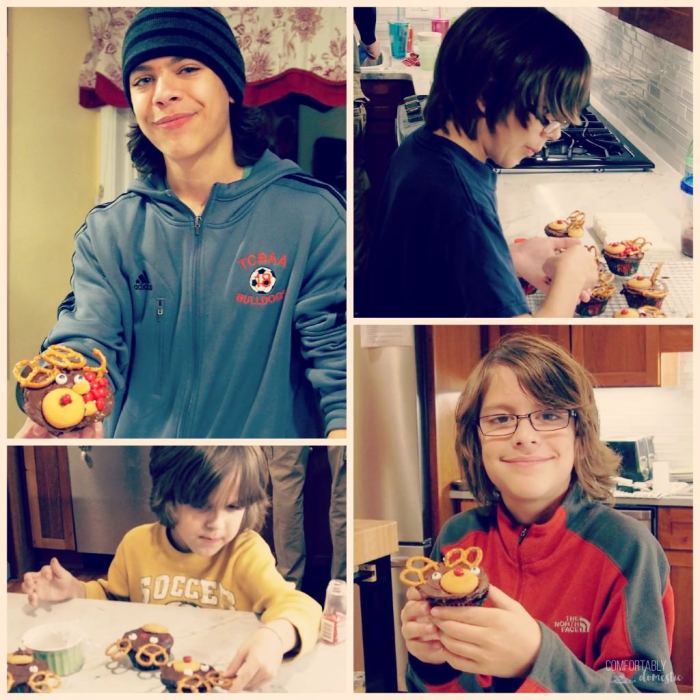 brothers making and decorating reindeer cupcakes