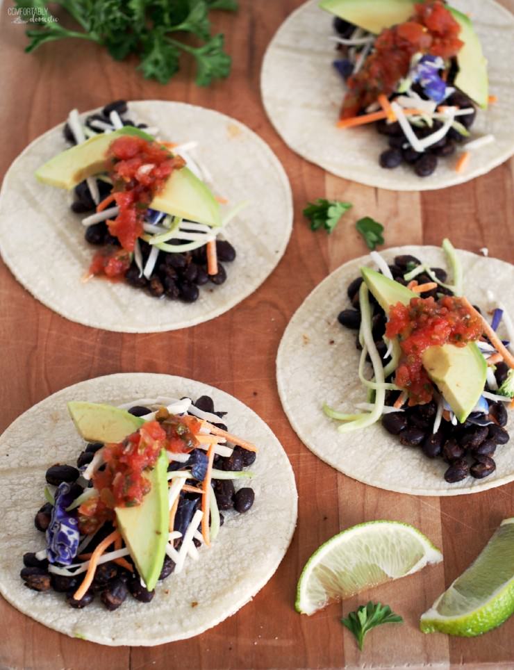 Spicy-Roasted-Black-Bean-Tacos is an easy vegetarian meal made with seasoned black beans, oven roasted to enhance the depth of the spices and compliment the satisfying fresh flavors. These tacos are anything but bland or ordinary!