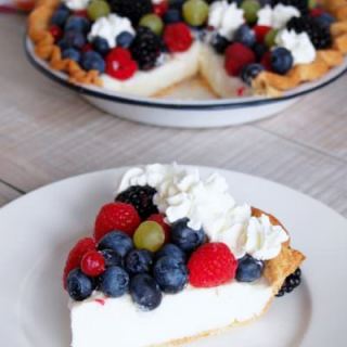 Vanilla-Cream-Pudding-Pie is a delightfully simple pie with creamy vanilla pudding, fresh berries and plenty of whipped cream nestled in a buttery crust. The egg-free filling is a snap to make from scratch!