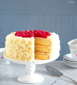 Vanilla-Buttermilk-Cake is an extra moist vanilla cake that is sure to impress when filled with raspberry and lemon, and enrobed in dreamy white chocolate buttercream frosting.